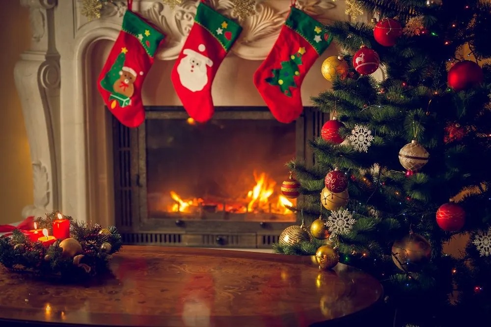 Stockings above fireplace with Christmas tree