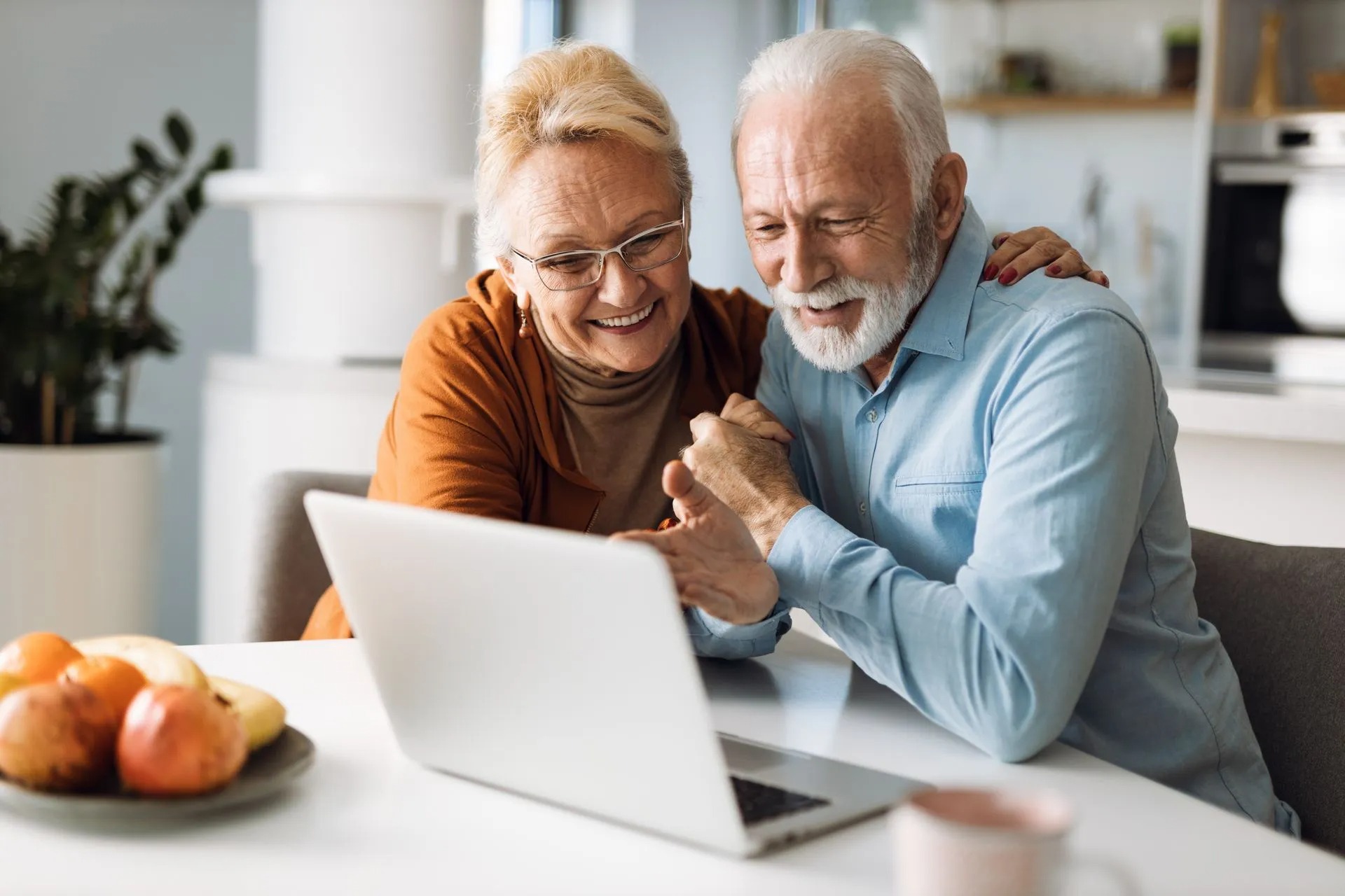 Couple looking at laptop