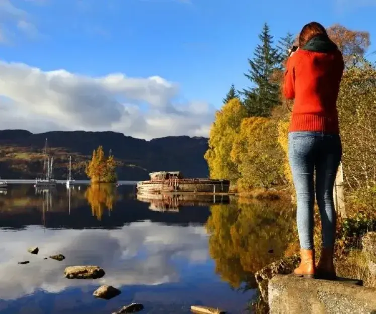 Woman stood at lake